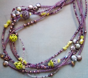 The lime-colored beads were enameled by me, using a torch.